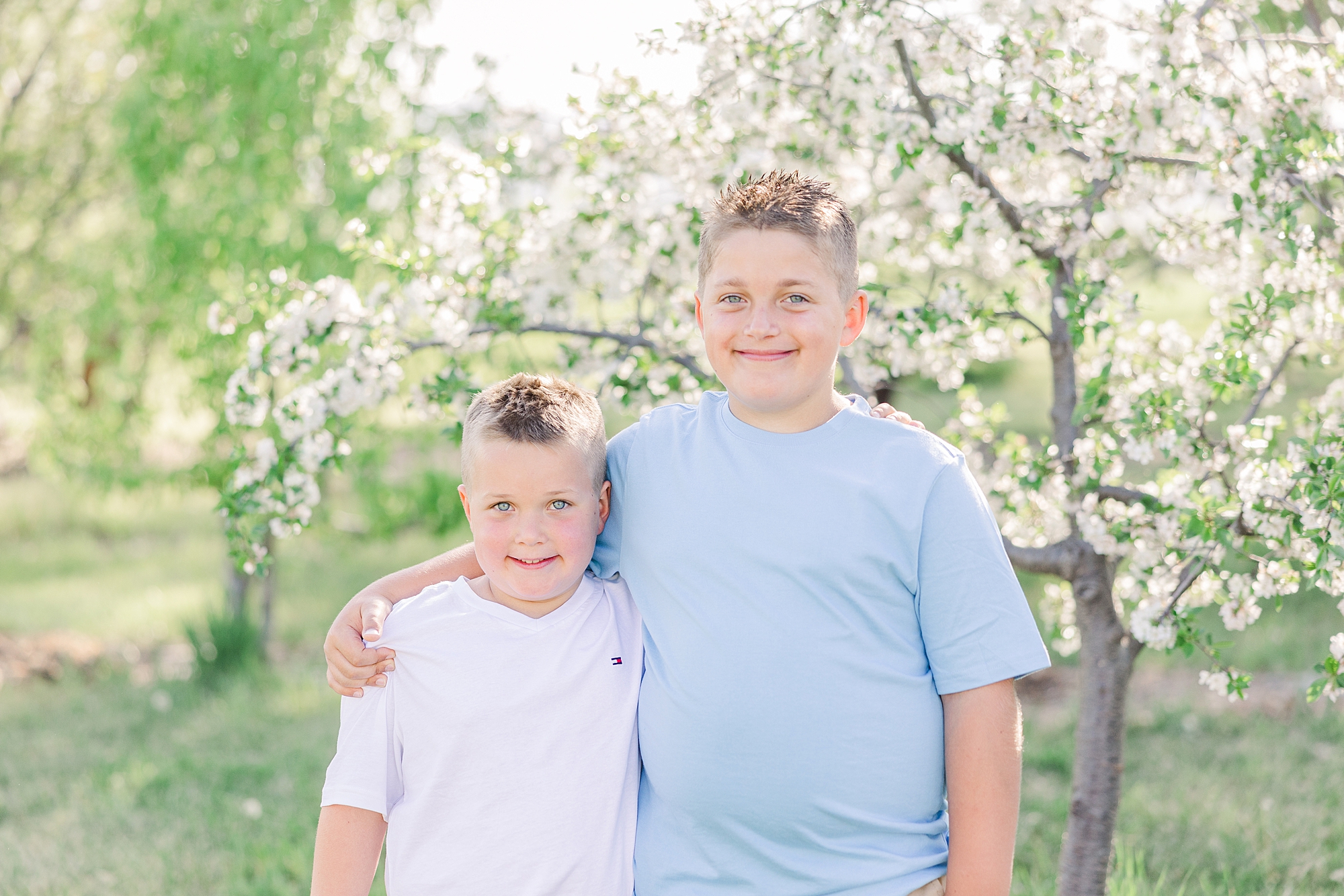 brothers hug during family portraits