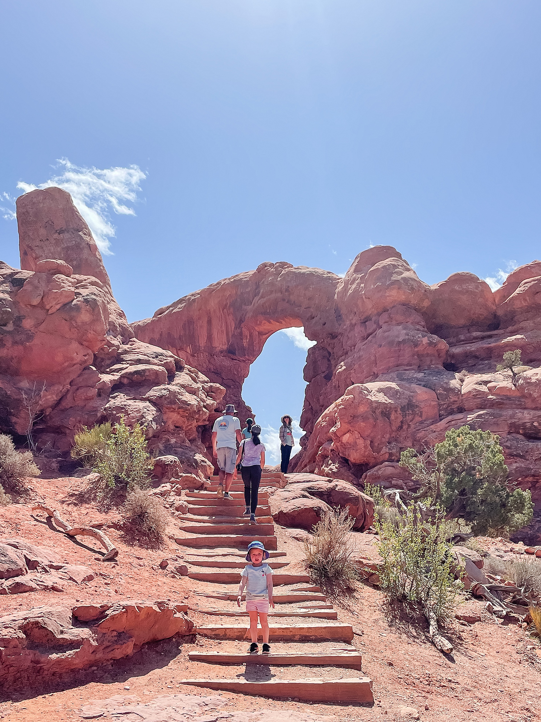 family hike at the Arches National Park in Moab Utah during family vacation