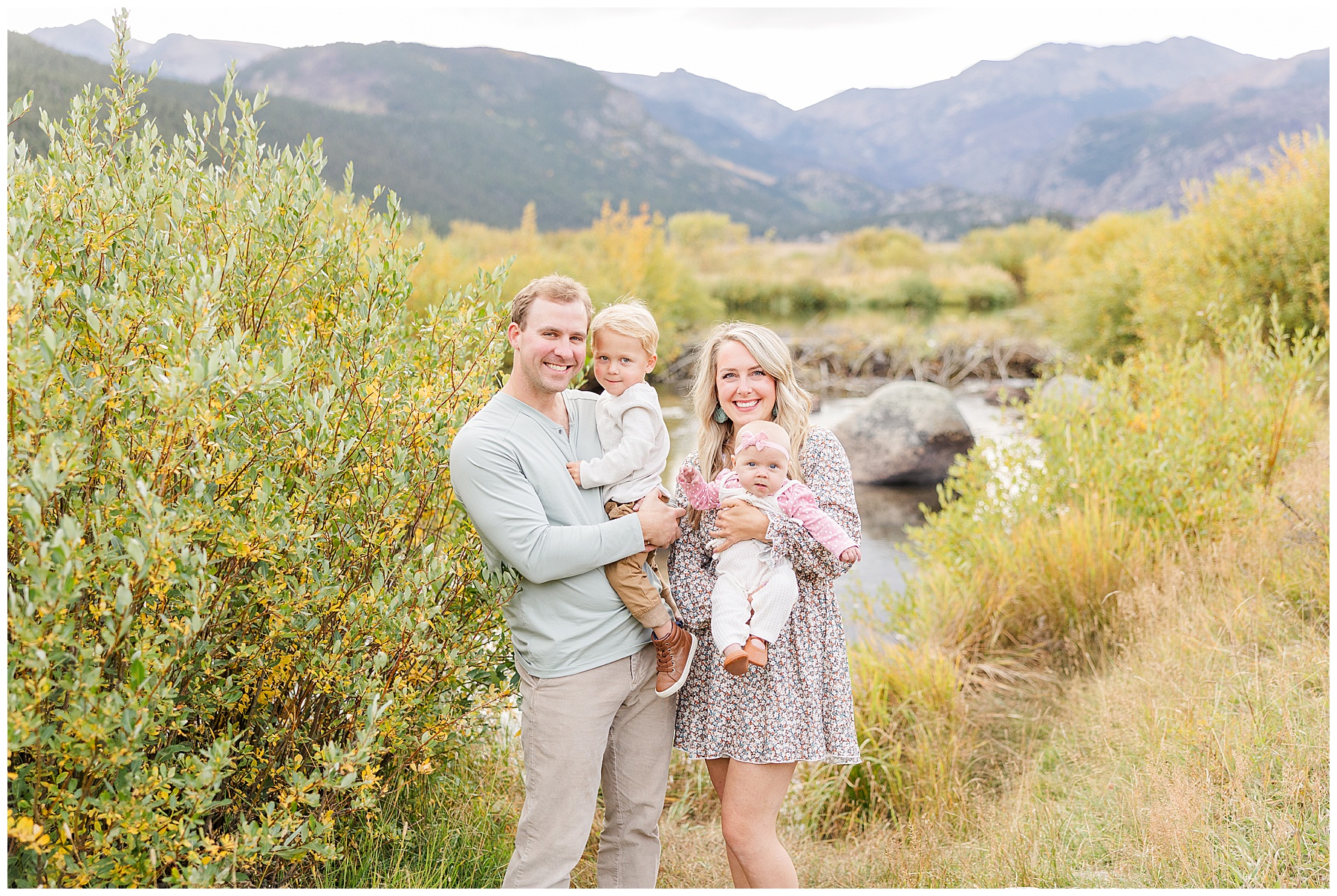mom dad son and daughter standing by pond in Rocky Mountain National Park Colorado Family Photographer
