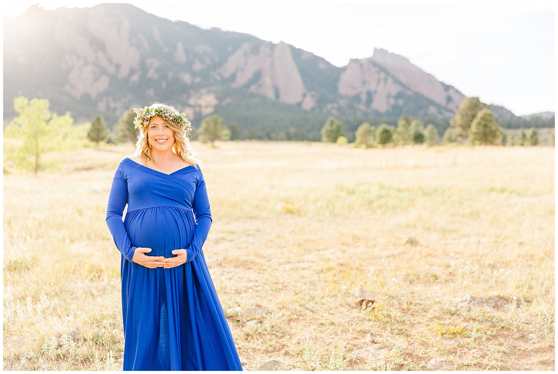 mother cradles her baby bump during photoshoot in Boulder CO