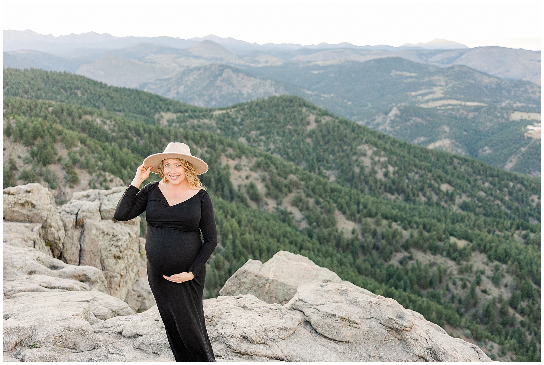 mom holds hat during maternity session in Northern CO Boulder photoshoot