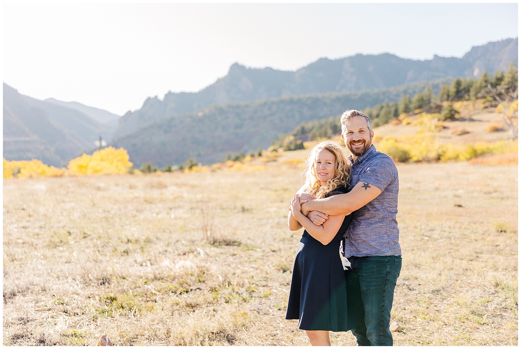 Family photographer Catherine Chamberlain captures couple with arms wrapped around each other at South Mesa during fall mini sessions