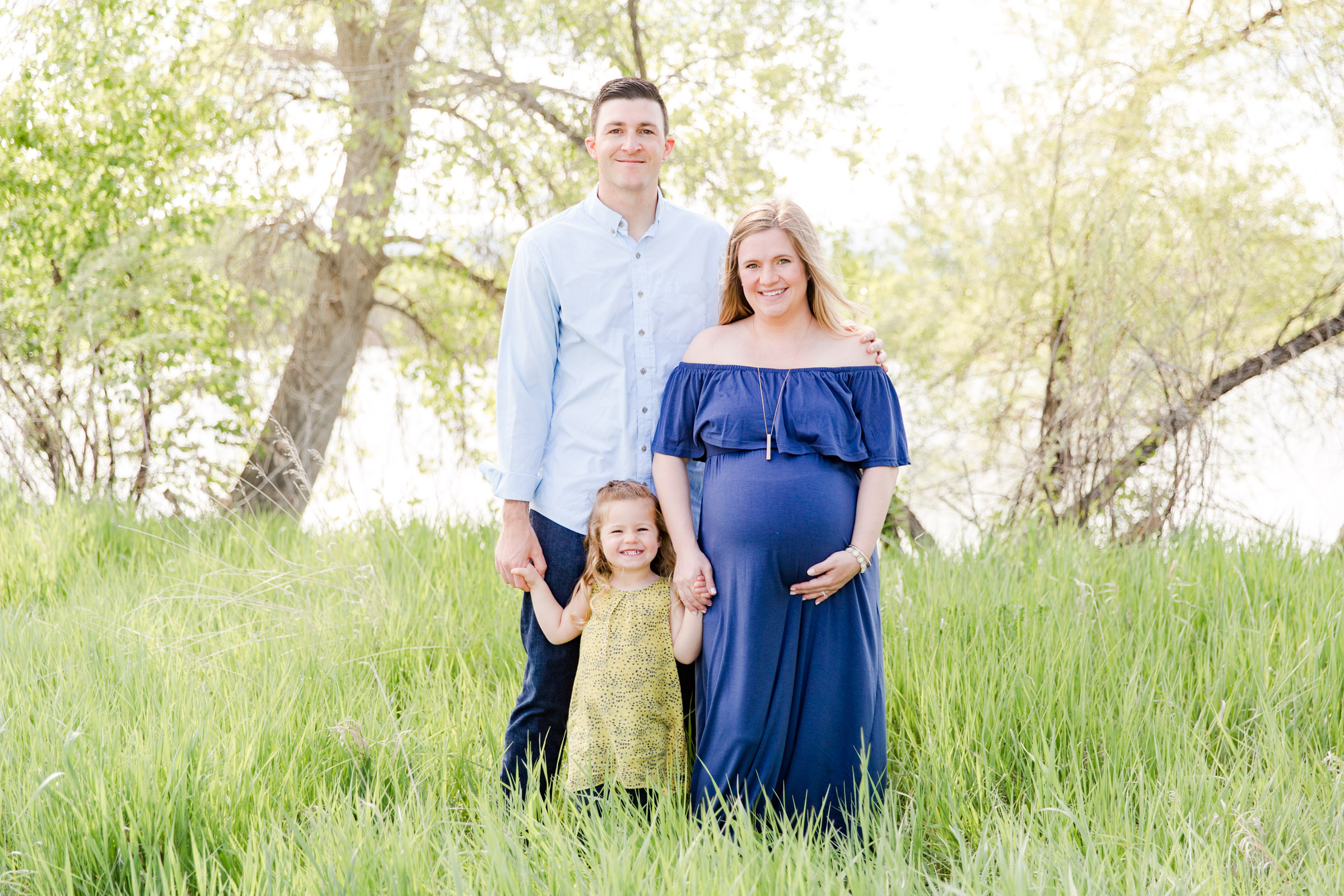 family of three poses at Golden Ponds in Longmont CO