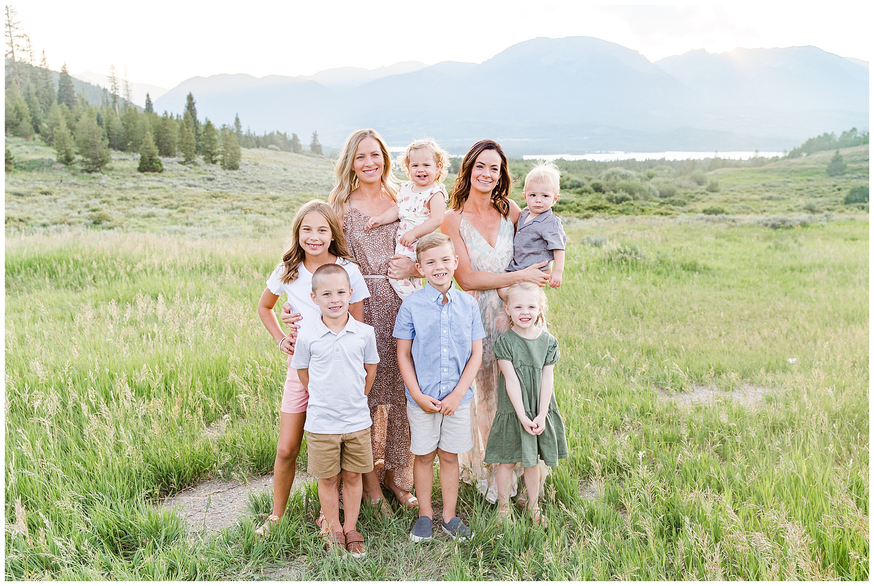sisters with their kids in a field in dillon colorado