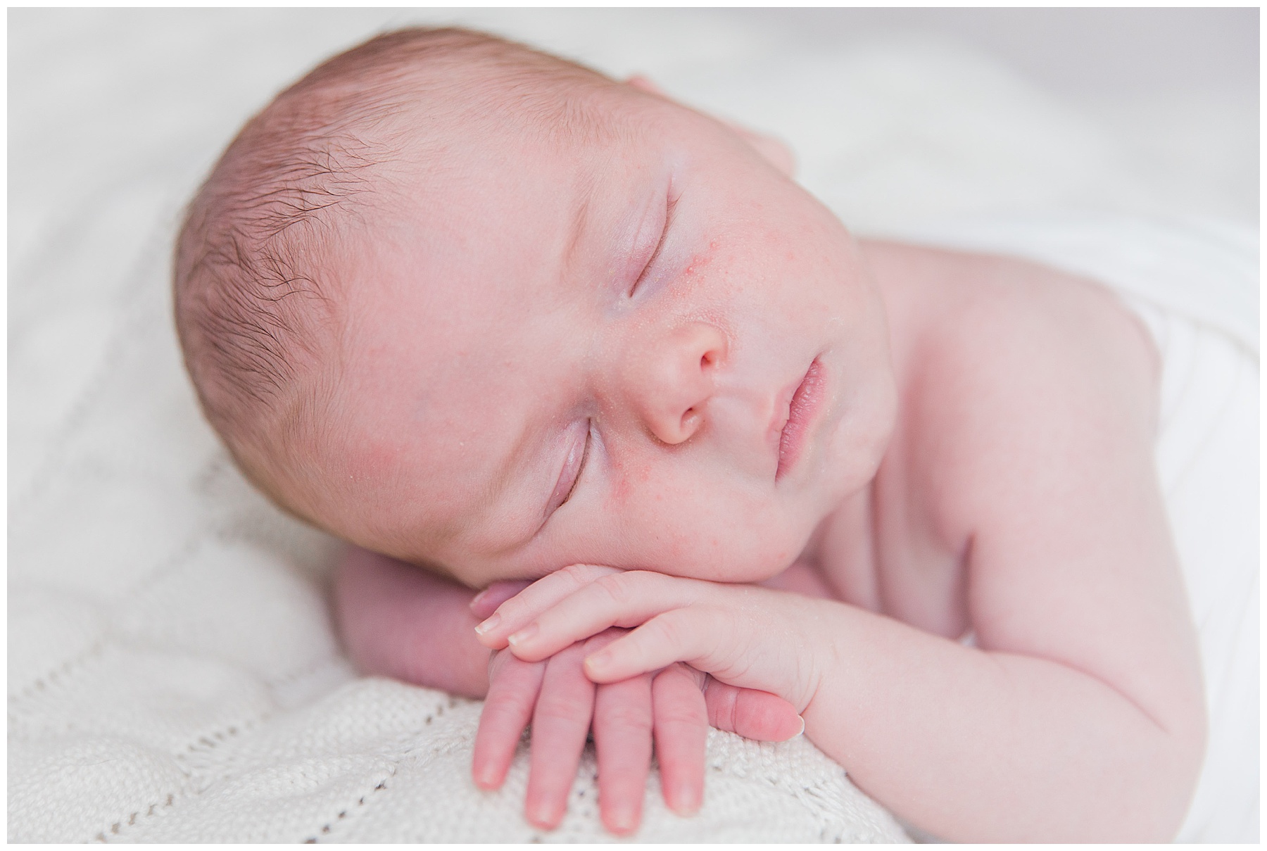 baby sleeping with hands propped