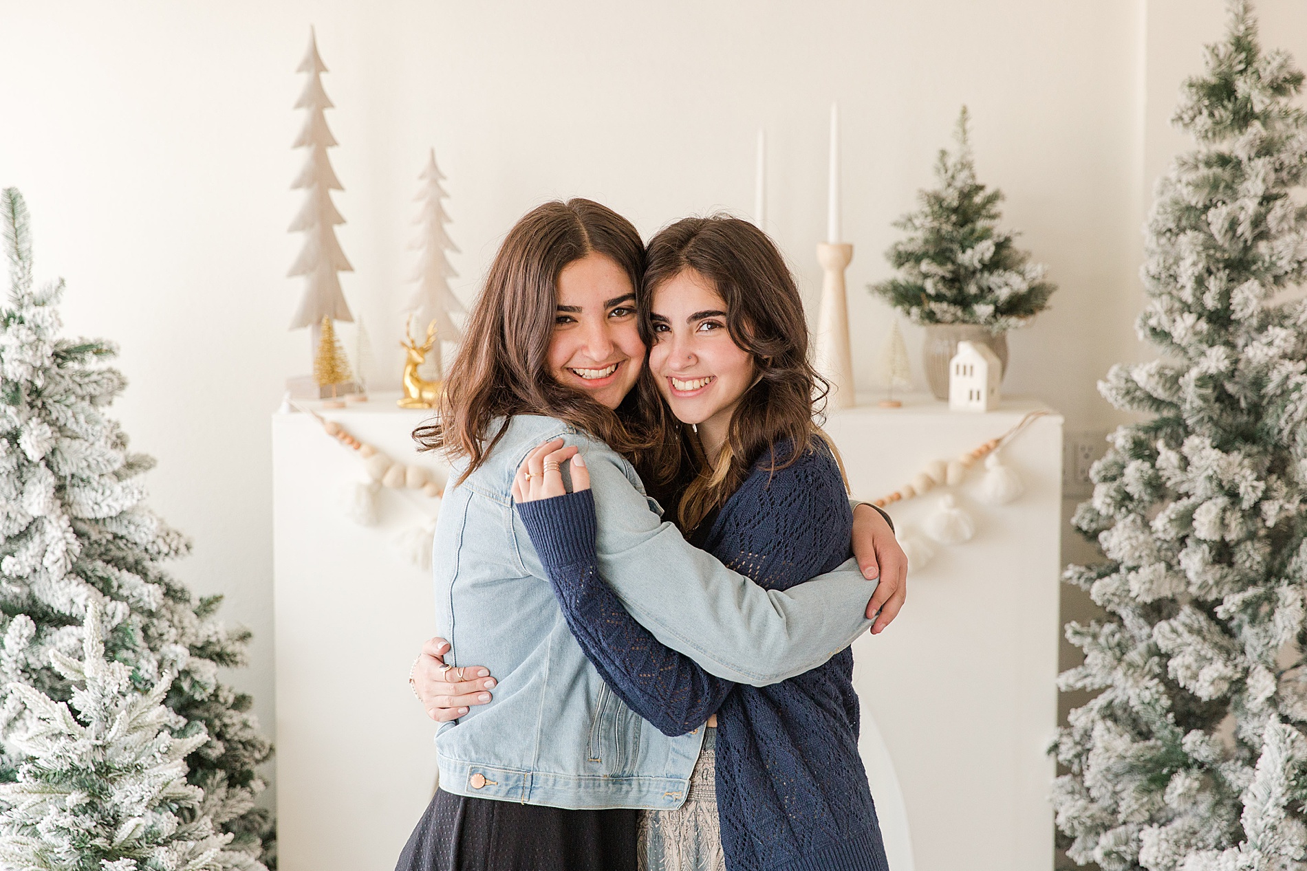 Sisters hug during Christmas mini session in Longmont CO