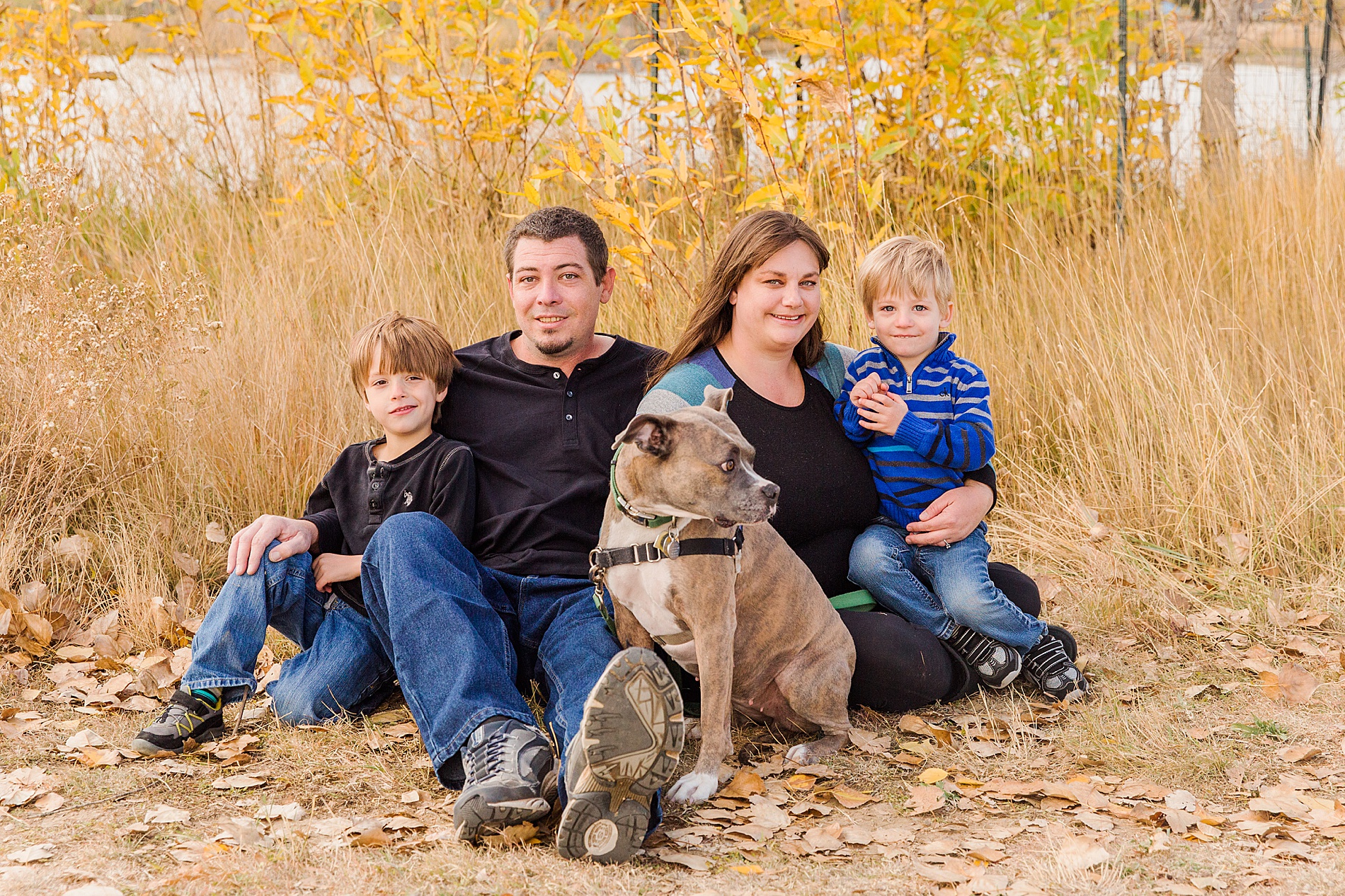family of four with their dog during fall mini session