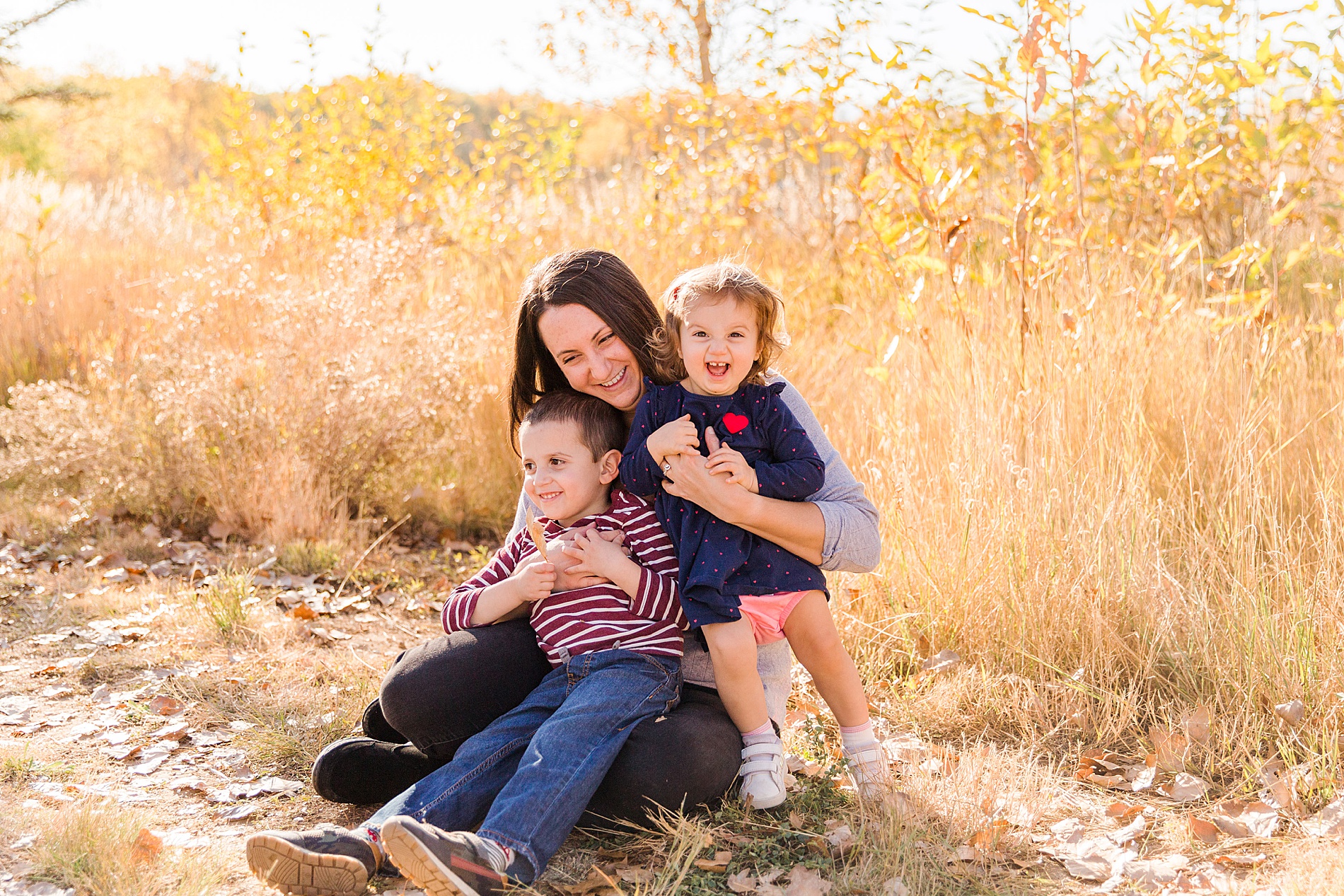 mom with 2 kids during Fall Family Mini Sessions in Longmont Colorado