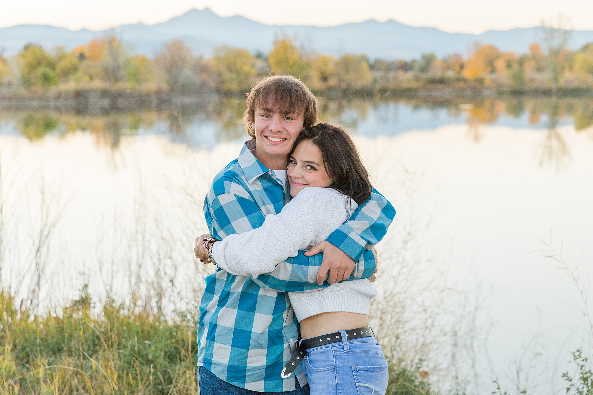 brother and sister hug during Golden Ponds Fall Family Portraits