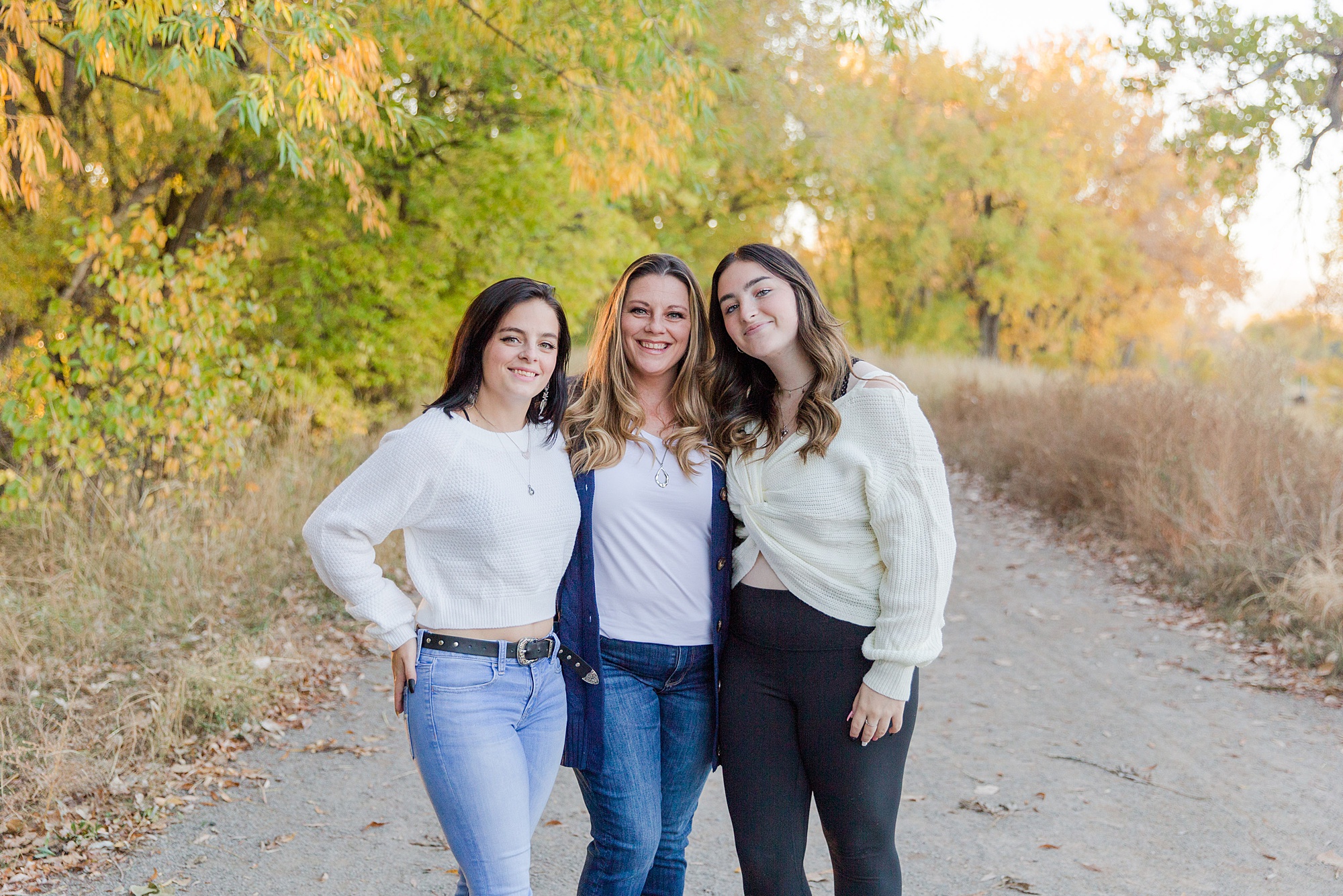 mom and two daughters during Golden Ponds Fall Family Portraits