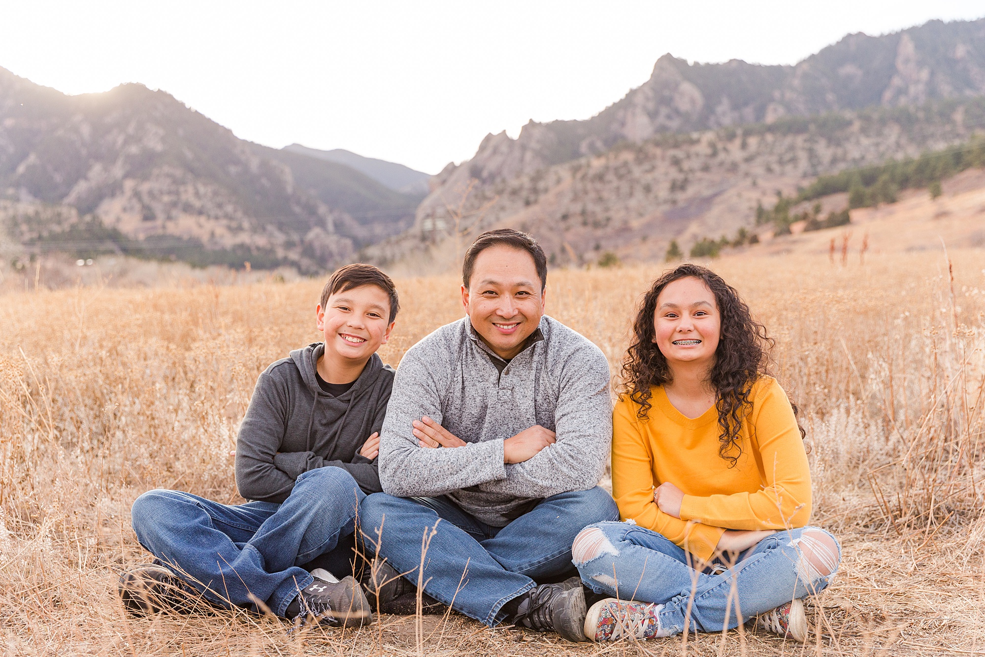 CO family photographer captures dad sitting with his two kids