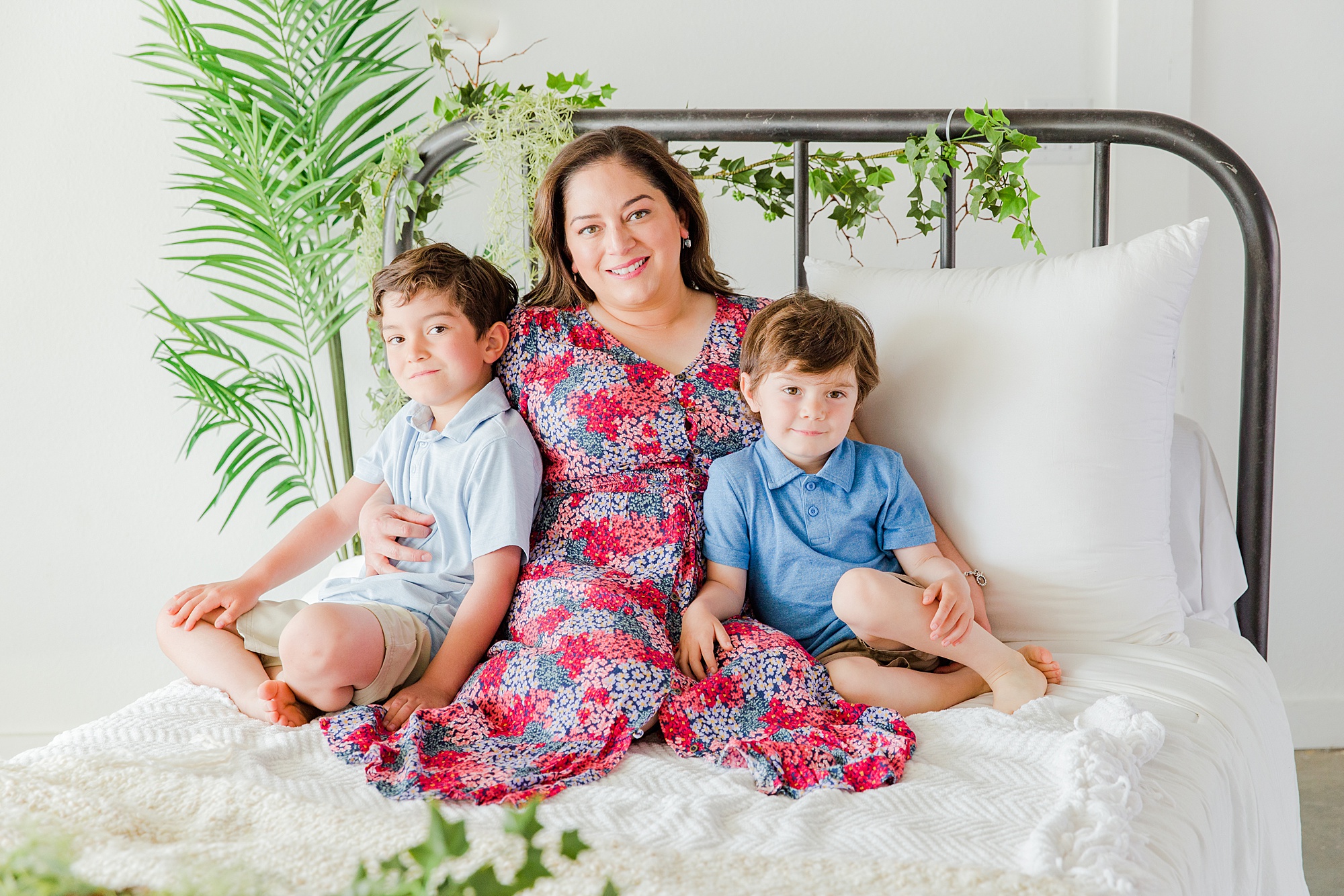 mom and her two boys snuggle during Mommy + Me Mini Sessions by Longmont, CO Family Photographer