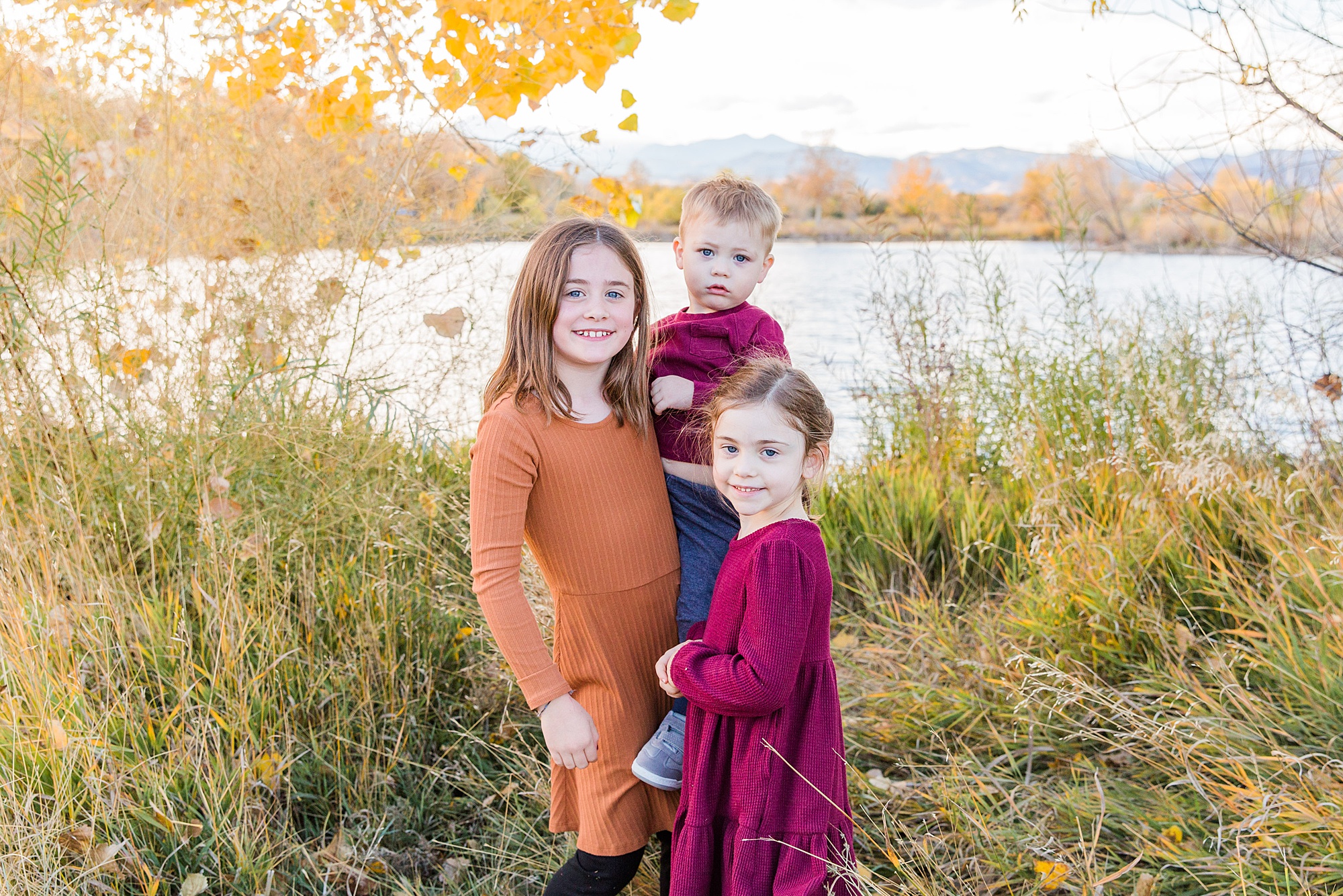 3 siblings together during fall family photos