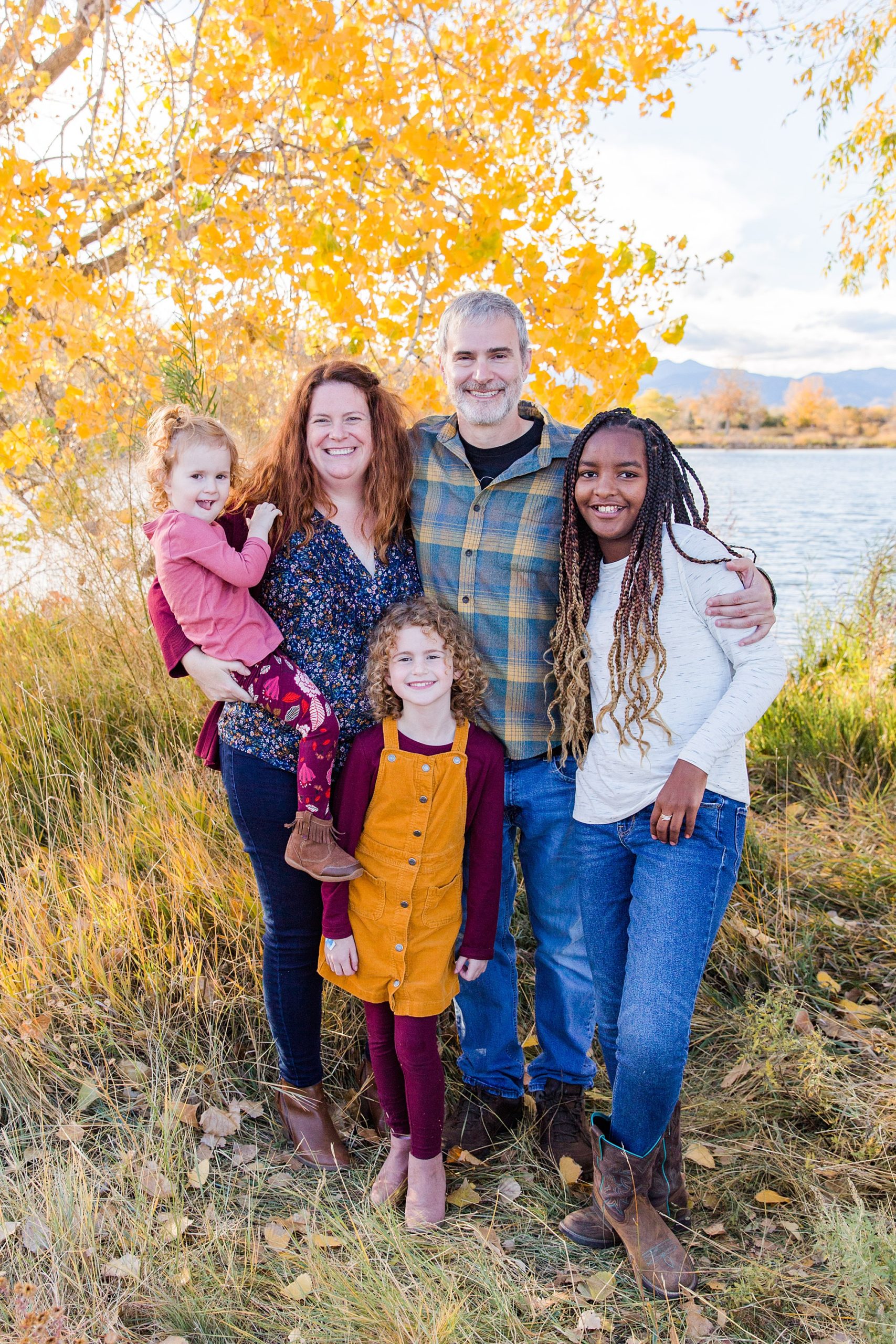 parents with their three daughters during fall family photos