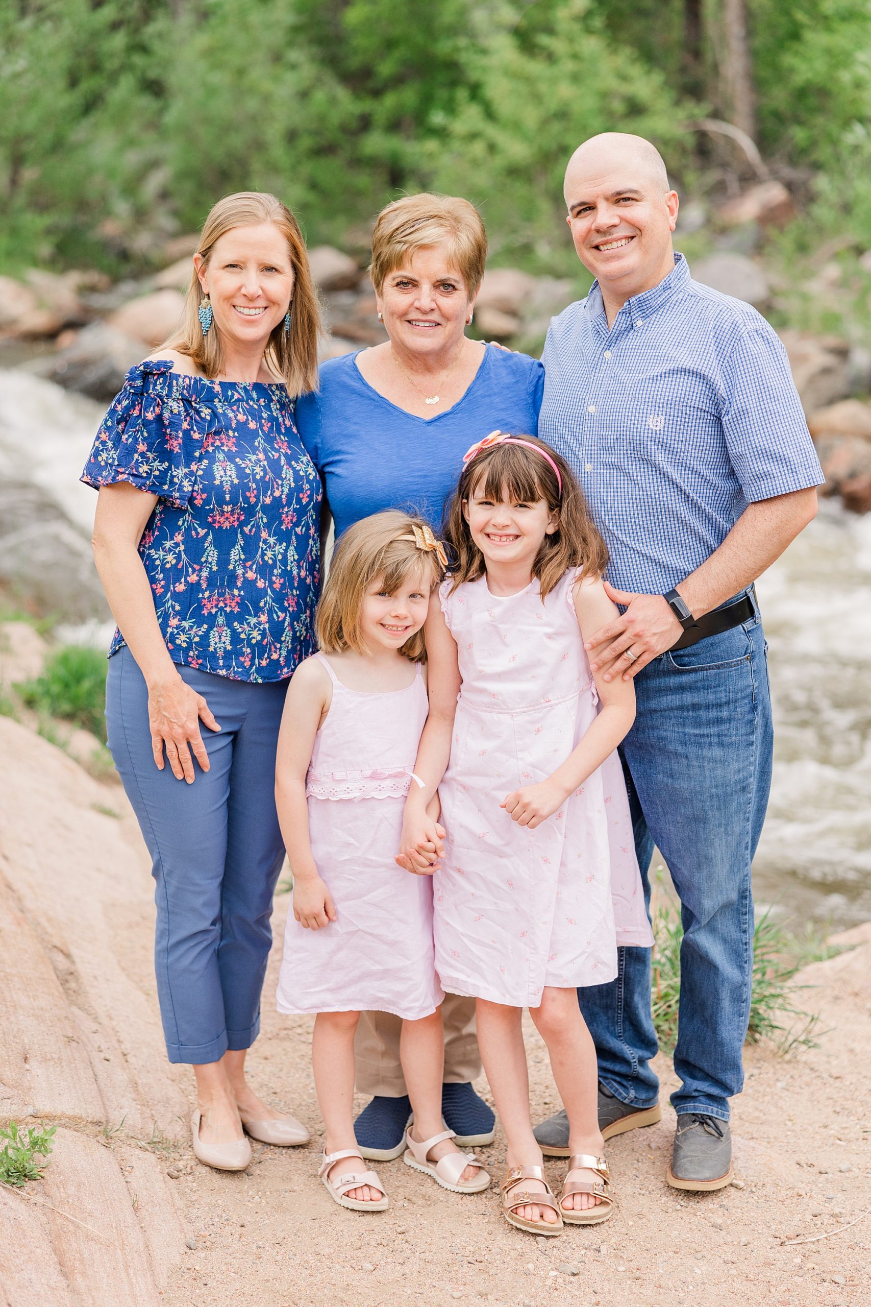 Parents with their two daughters and grandma in Buckingham Park for Family Portraits in Boulder, CO
