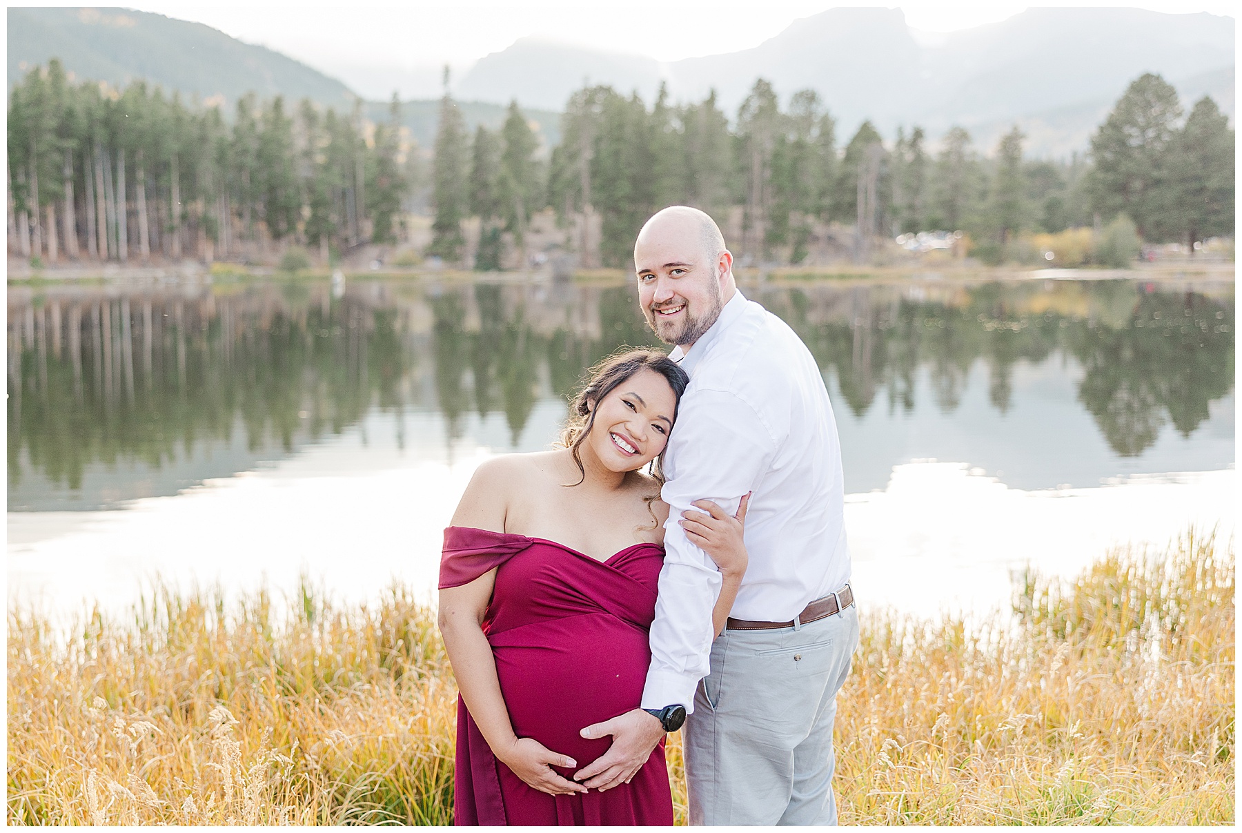 mom and dad holding belly during maternity session in Northern Colorado