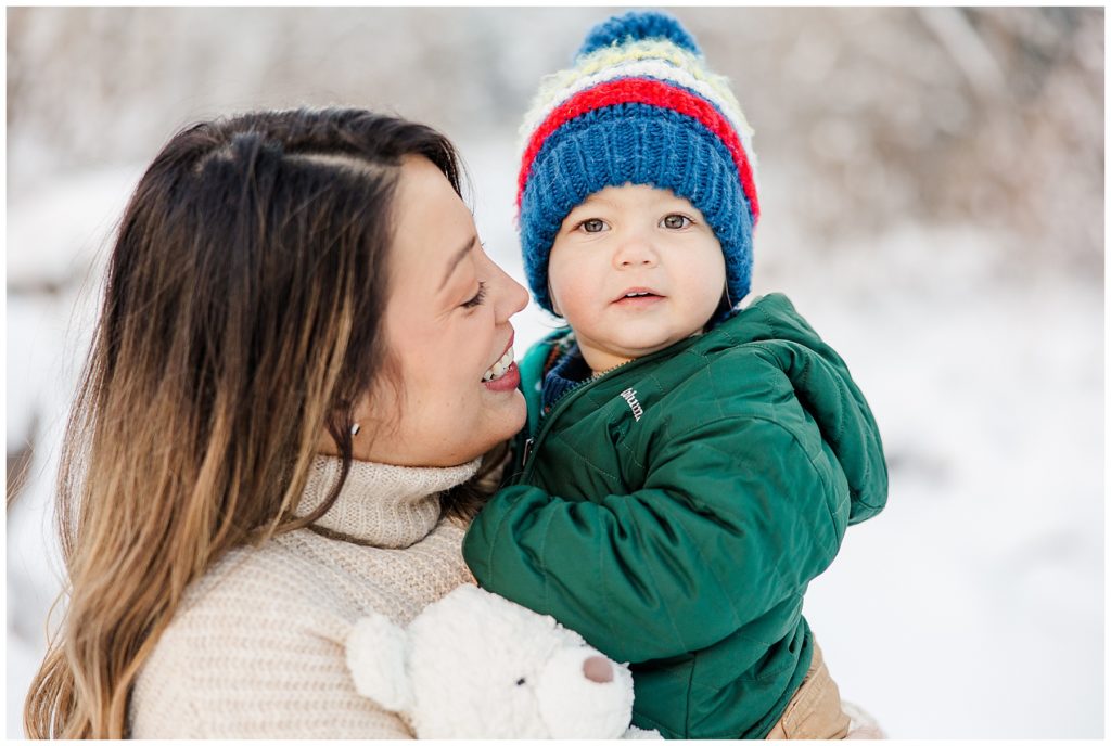 mom smiling at toddler in winter in Boulder, CO