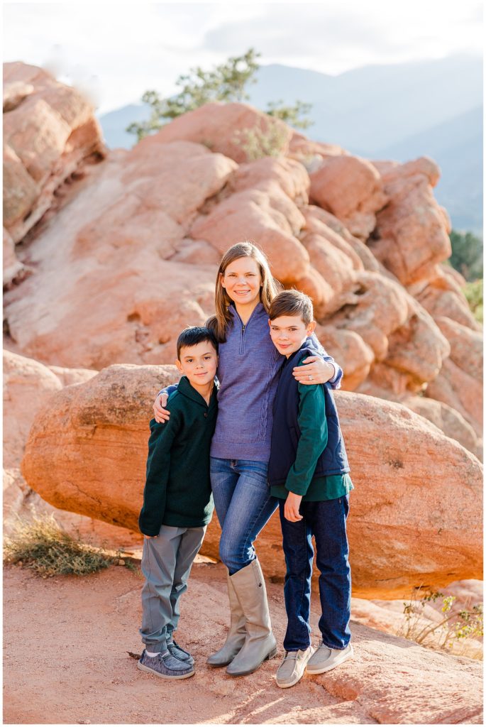 Mom stands between her two young sons in Northern Colorado for for fall family mini sessions