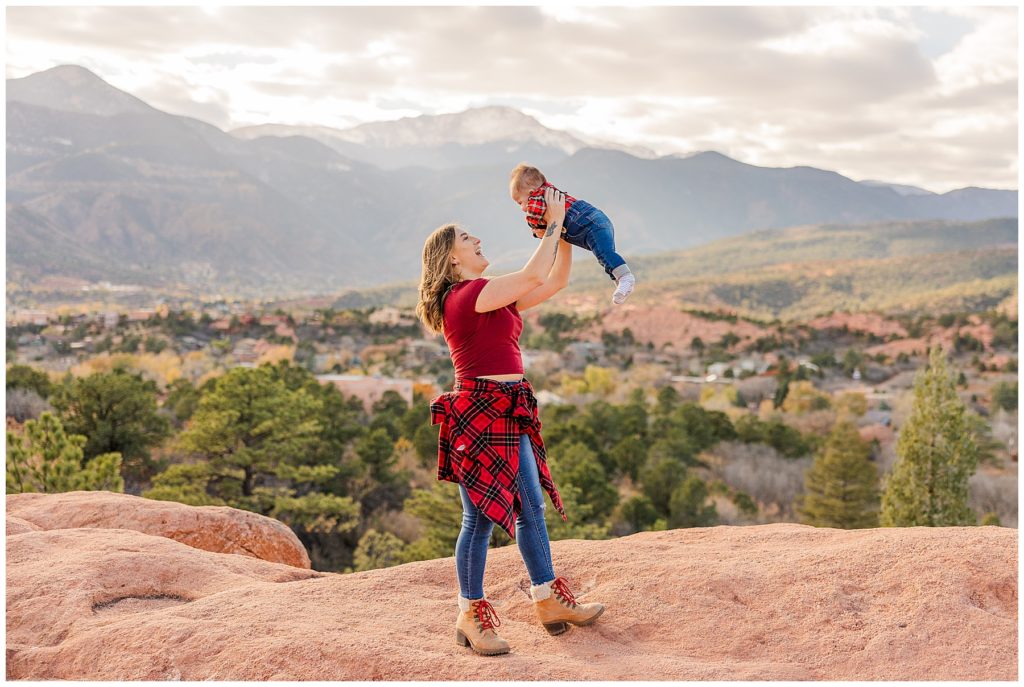epic photo of mother holding her baby son in the air at Garden of the Gods in Colorado Springs, CO