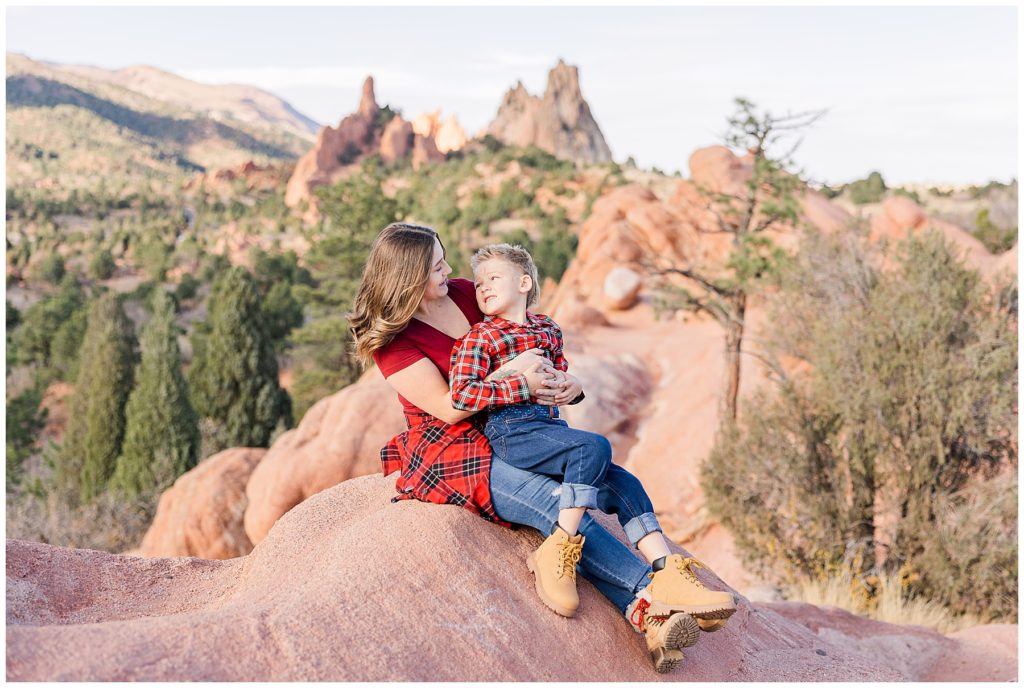 Northern Colorado family photographer captures brother and sister looking at each other during photoshoot