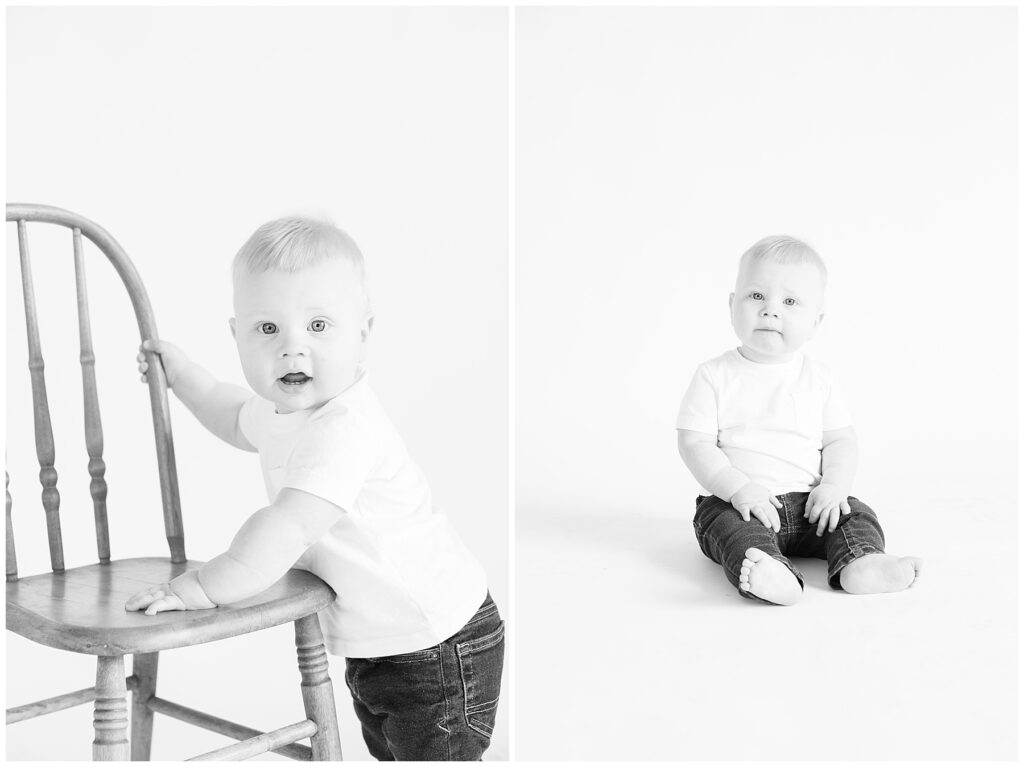 Baby props himself up using a chair during black and white photo session