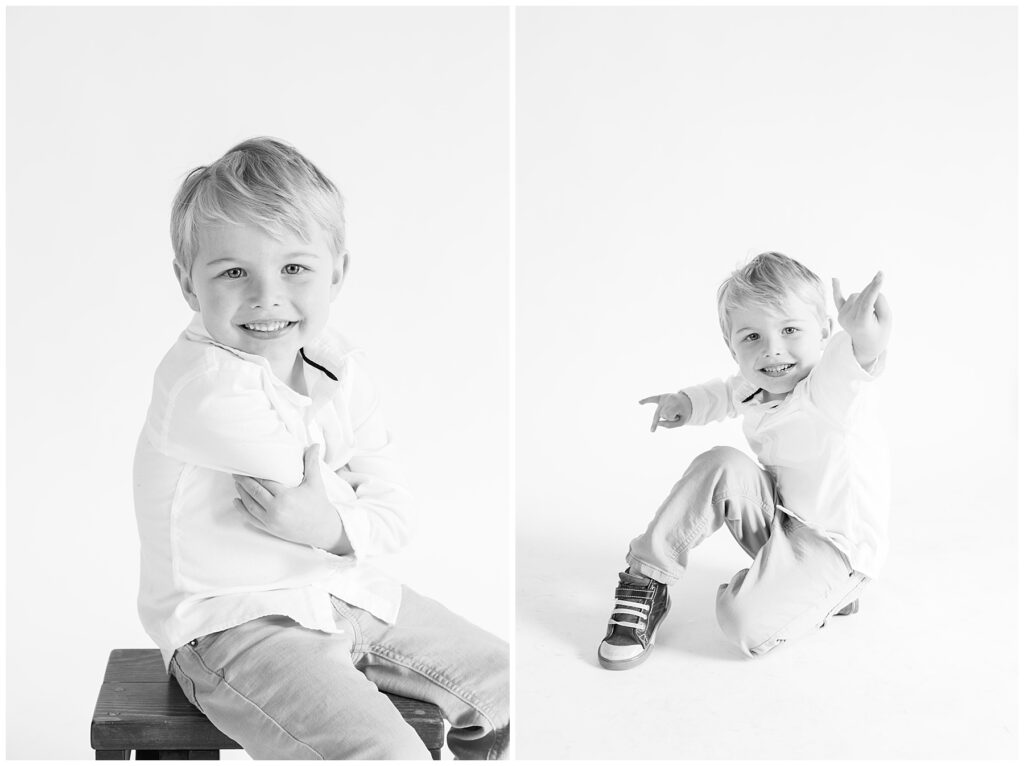 Boy poses on one leg with arms out during black and white photography session