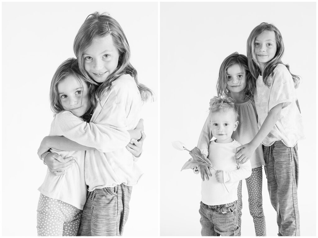 Three siblings hug for black and white light and airy photos