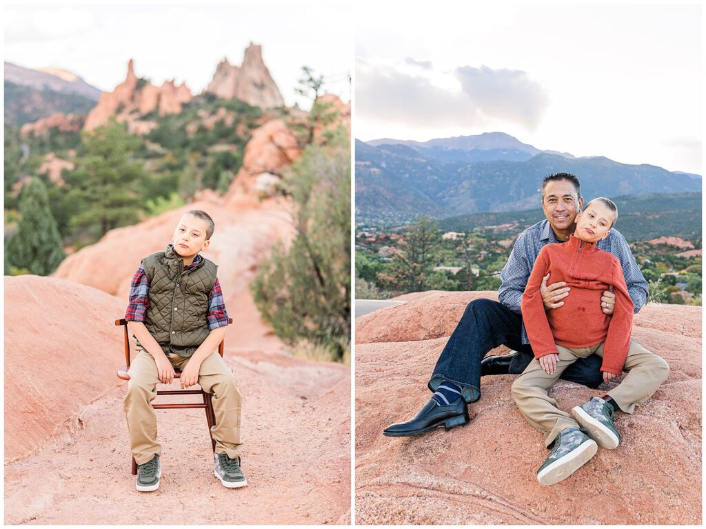 Father holds his son while they sit on the ground at Garden of the Gods outdoor photoshoot with Catherine Chamberlain Photography 