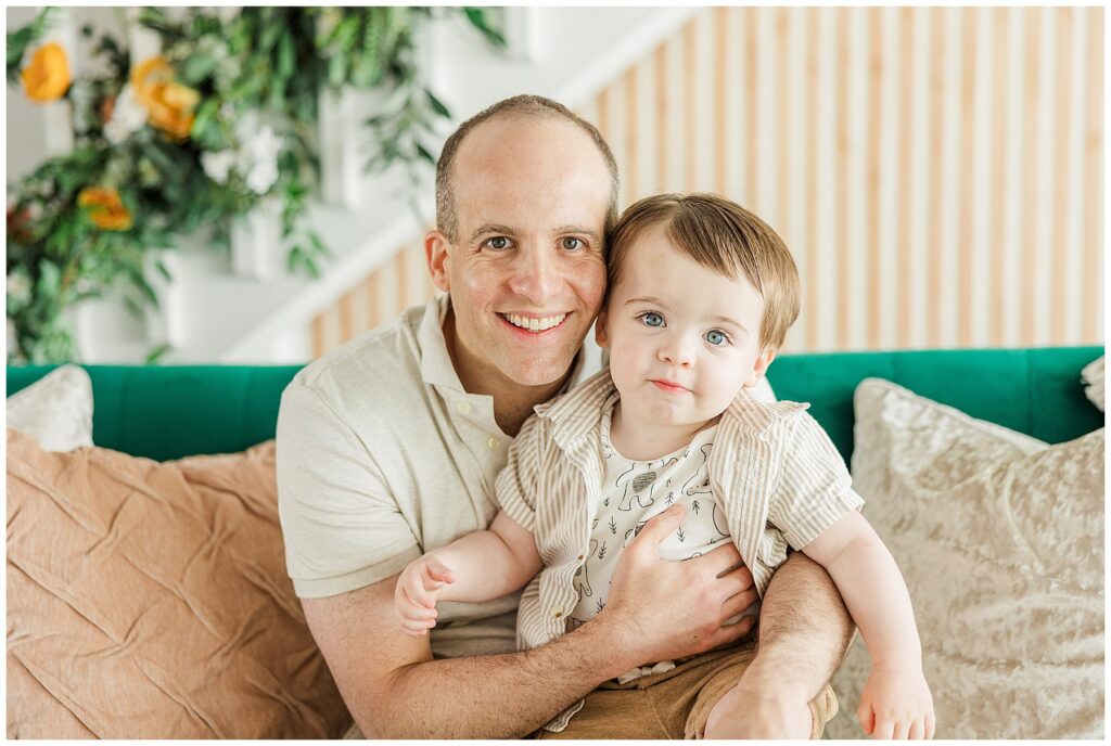 Father wraps his arms around his little boy for a mini session with Catherine Chamberlain Photographer