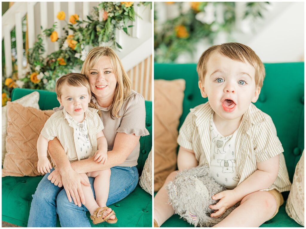 Little boys looks at the camera with a fun expression on his face while sitting on a green couch for in-studio family pictures