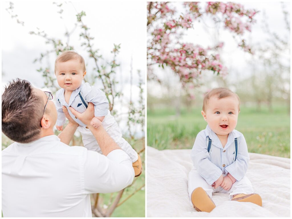 Dad faces away from the camera as he lifts his baby boy into the air over his head outdoor spring mini sessions