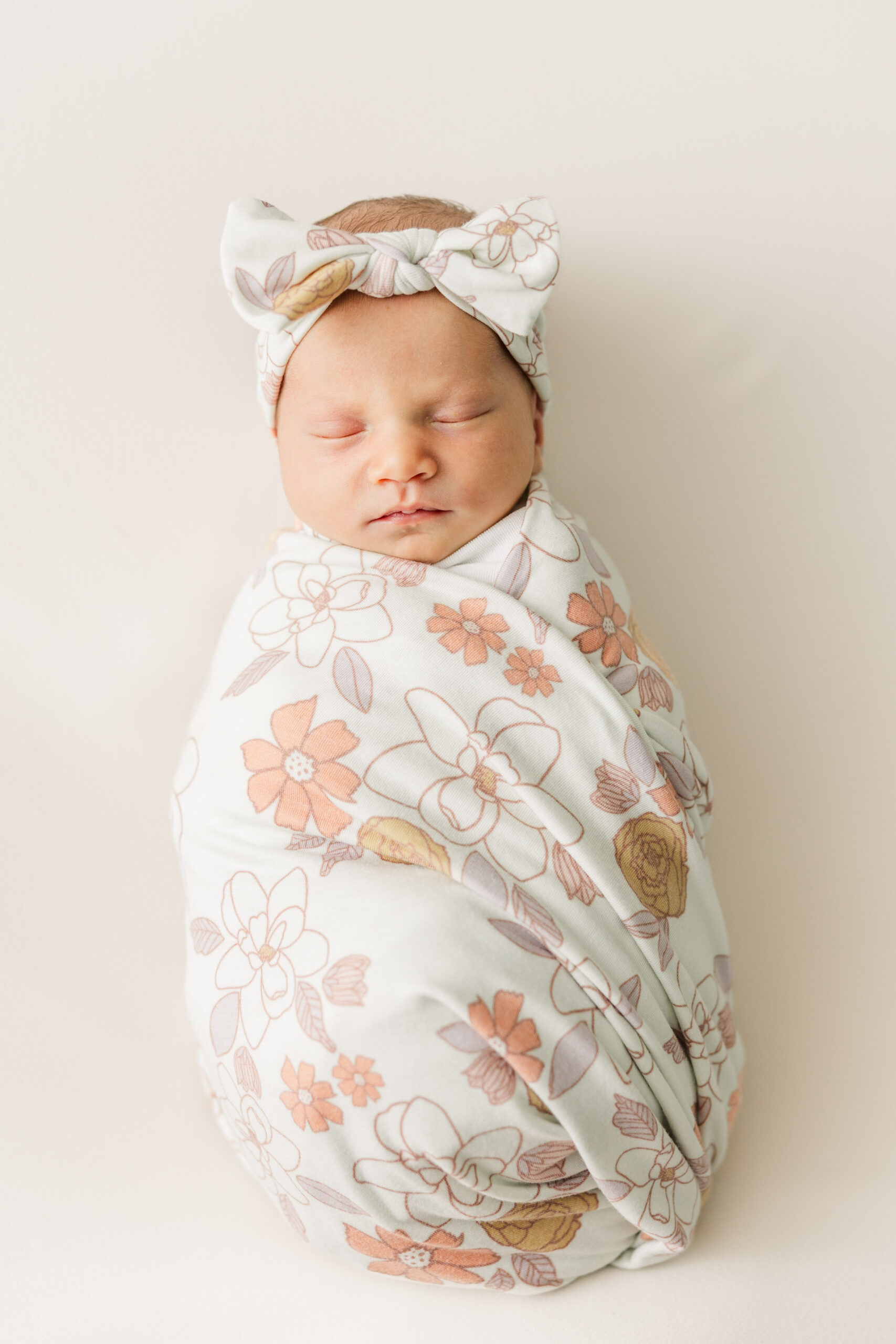 Baby girl swaddled for Peterson Family Newborn Session in Fort Collins, CO