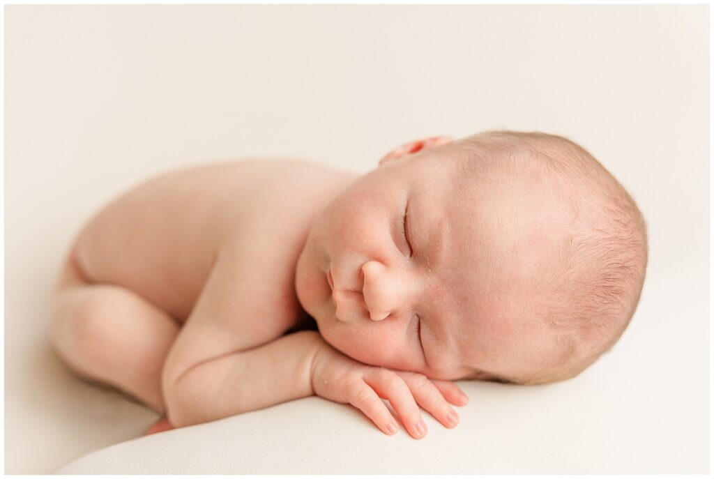 Newborn sleeps during this in-home Colorado newborn session
