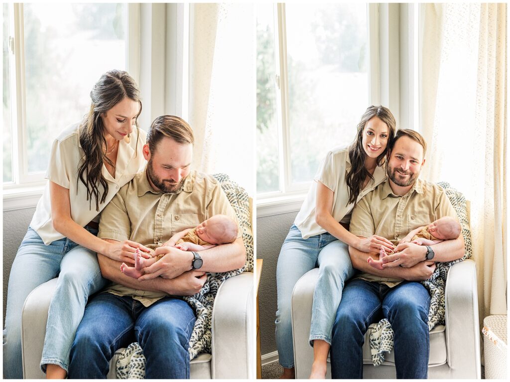 Dad holds his baby boy as his wife sits next to them on the edge of the chair this in-home Colorado newborn session