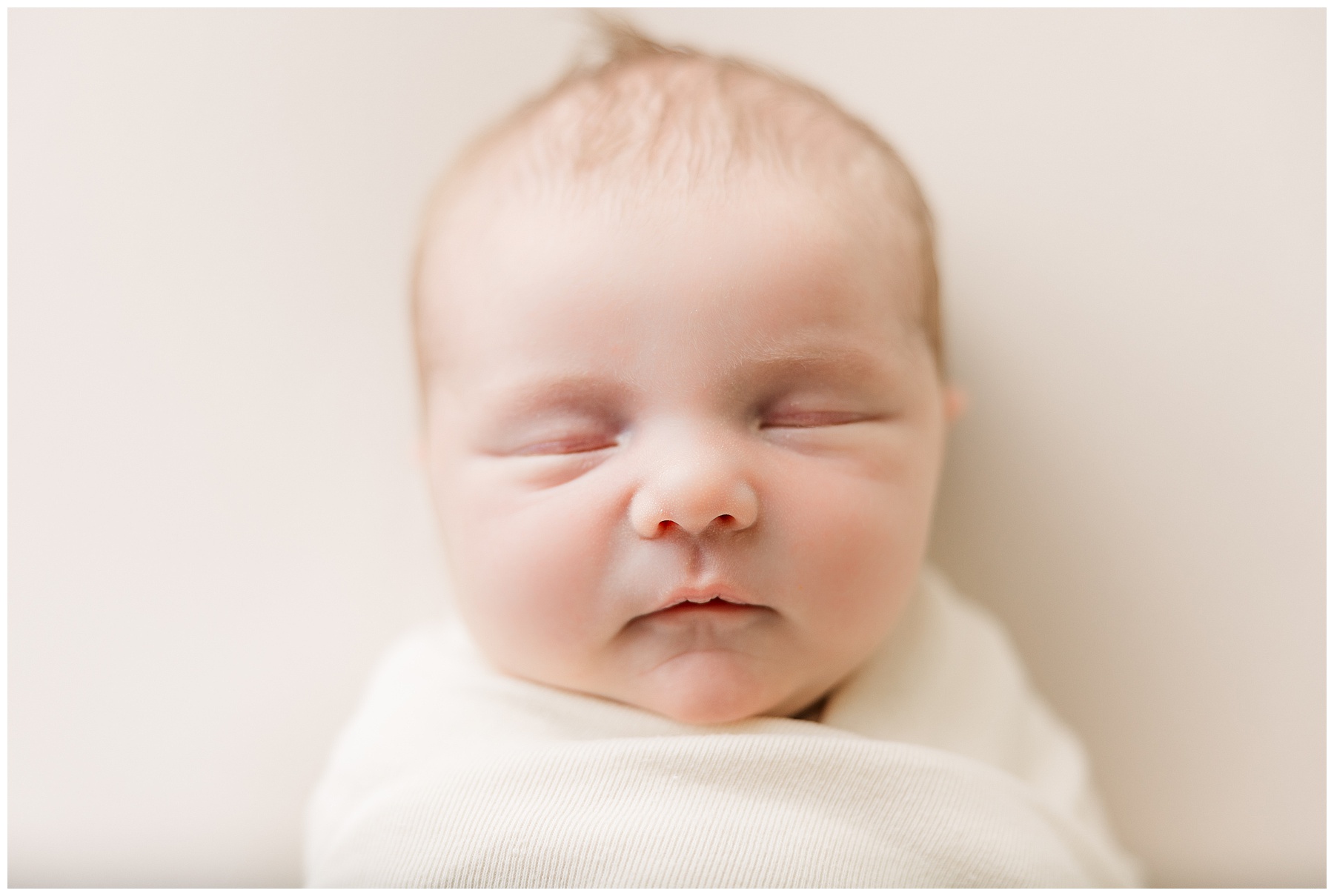 Head shot of a newborn baby during Schwartz Family Newborn Session in Fort Collins, CO