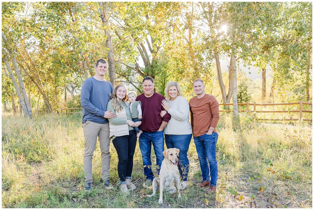 Six family members stand together and pose with their dog for the Stute Family Outdoor Session at South Mesa Trailhead in Boulder, CO