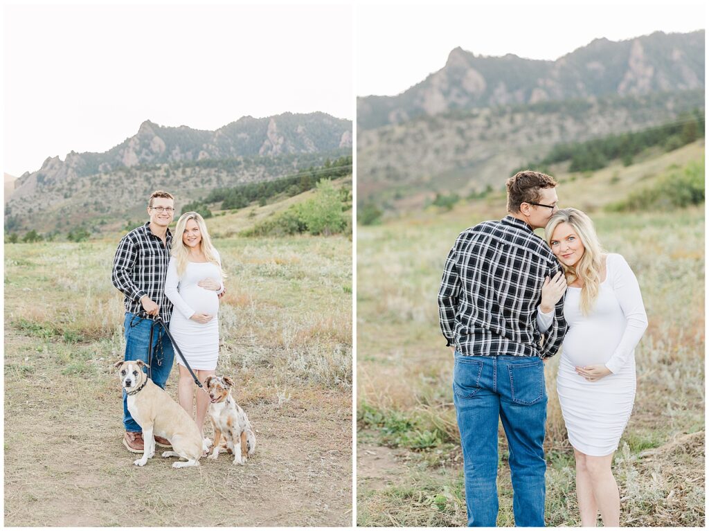 Expecting couple pose with her hands on top and bottom of her belly with their two dogs at their feet