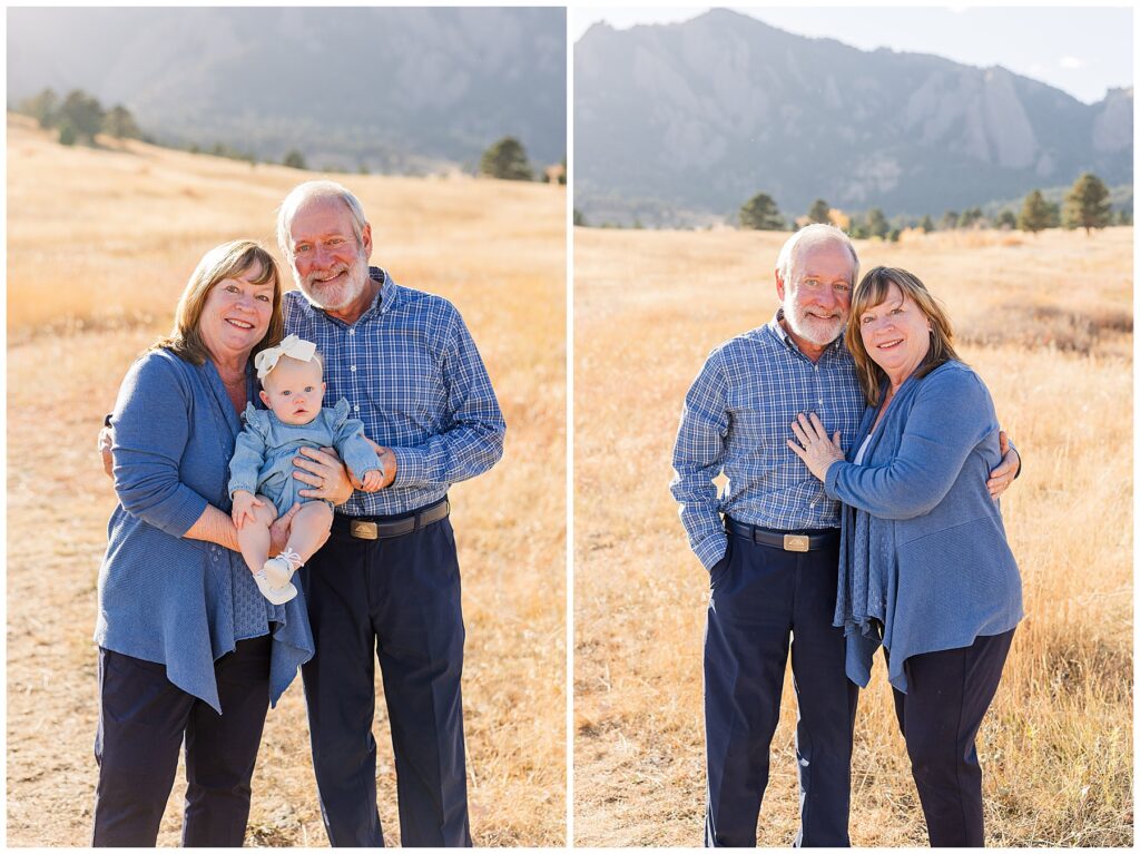 Grandma and grandpa hold their granddaughter in a field with a mountain behind them