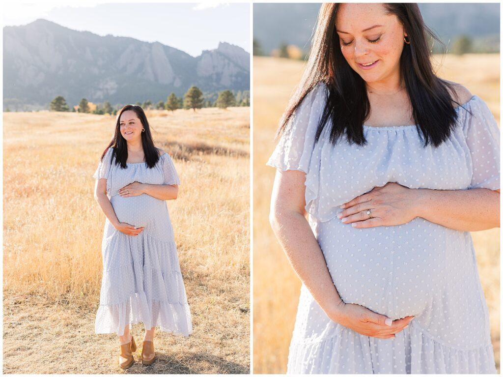 Expecting mother looks down at her belly for maternity photos 