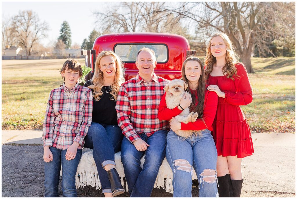 Family of five plus their dog have photos taken outside in Longmont Colorado for a Christmas card