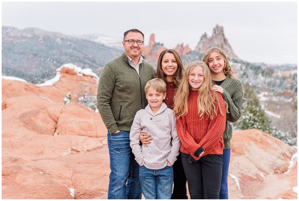 Family of five pose for snowy outdoor family minis in Colorado Springs with Catherine Chamberlain Photography