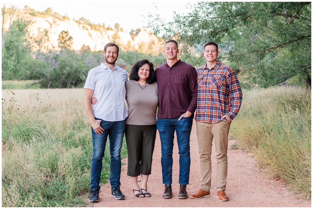 Mom poses with her sons and son-in-law