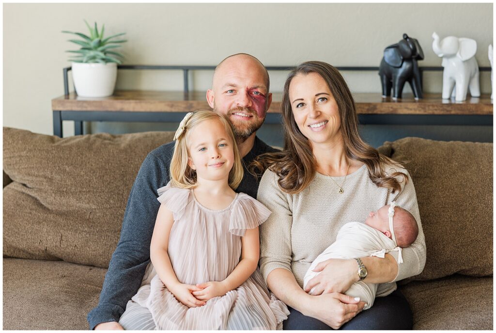 Family of four pose for Denver Indoor Newborn Session