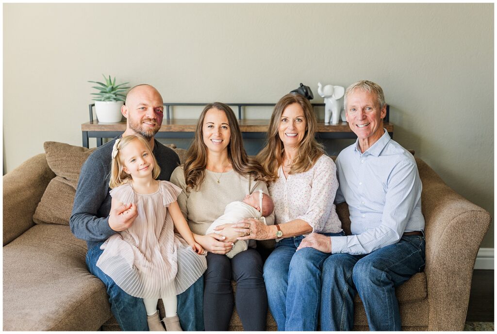 Extended family pose for newborn photos with Catherine Chamberlain Photography