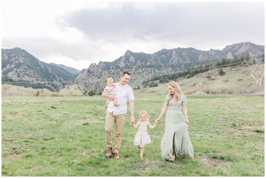 Family walks hand-in-hand for light and airy outdoor photos 