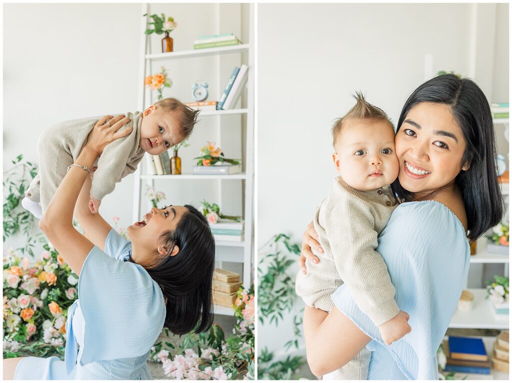 Mom lifts her baby over her head as the baby looks directly at the camera for light and airy photos