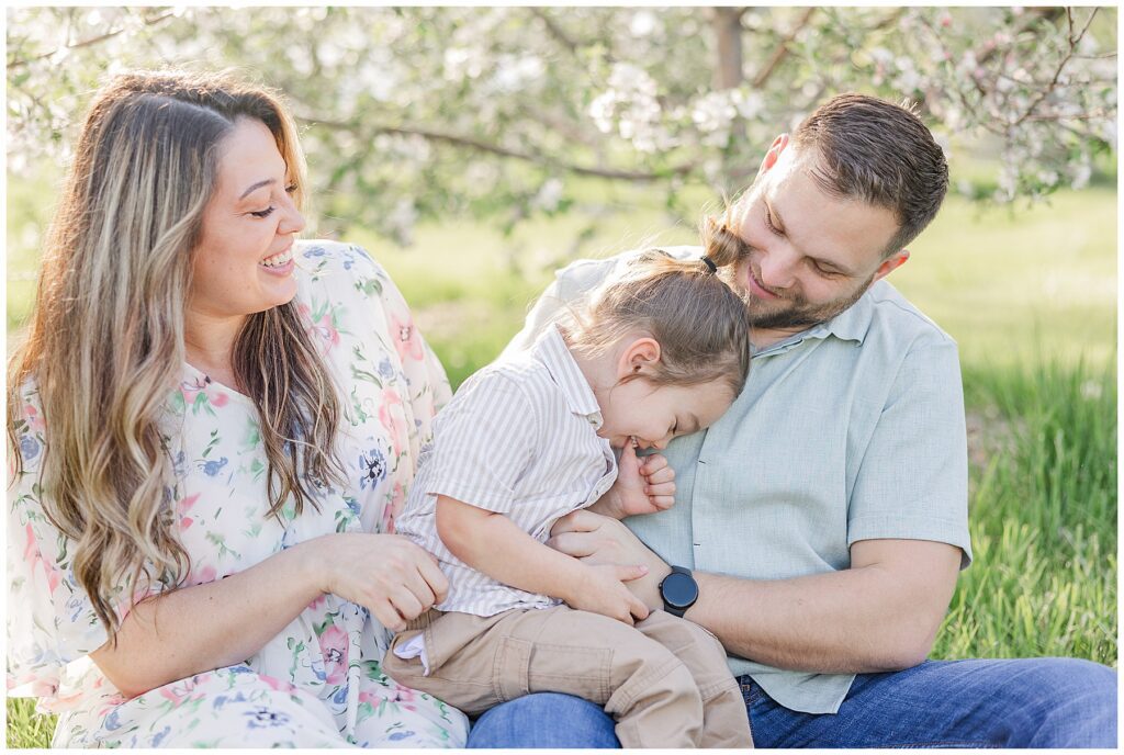 Candid shot of a family laughing during a photoshoot