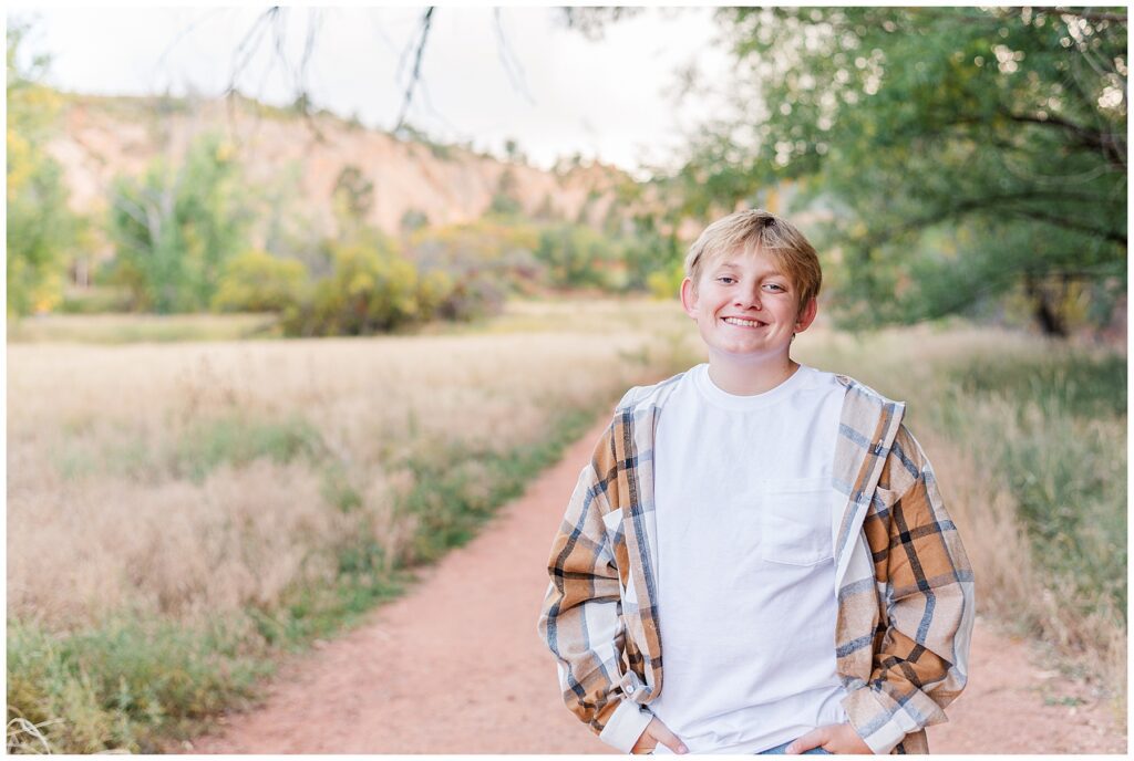 Son poses for outdoor photos with Catherine Chamberlain Photography in 
In beautiful Colorado Springs charm