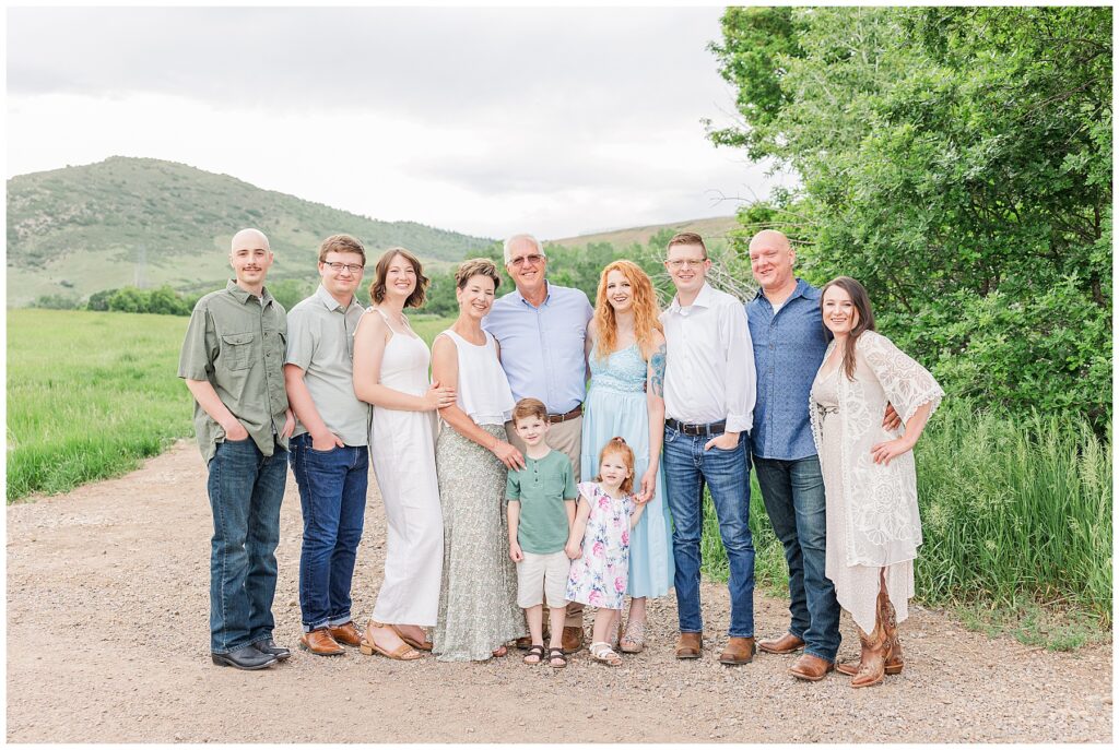 Extended family poses in Colorado for light and airy outdoor photos with Catherine Chamberlain