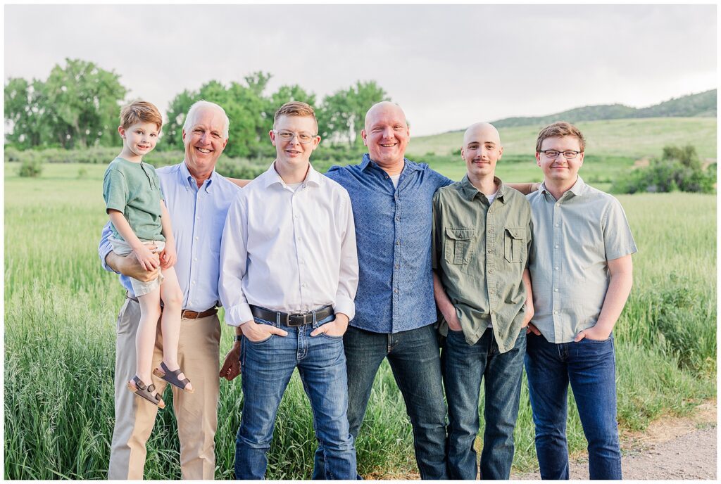 All the men of the family pose for a pictured in a line in Colorado